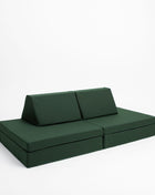 Multifunctionele Monboxy Montessori speelbank in bankopstelling met twee rugkussens – stijlvol en kindvriendelijk ingericht.