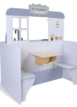 Gerardo’s Toys 2-in-1 eetcafé met zicht op de restaurantzijde met tafel en zitbanken.