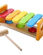Gerardo’s Toys 2-in-1 Houten Muziekhamerbank met vijfkleurige xylofoon en drie ballen onderin.