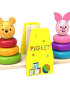 Gerardo’s Toys Houten Winnie de Poeh Balans Stapelspel uitgepakt met figuren van Winnie de Poeh en Knorretje.