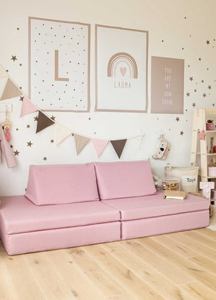 Monboxy Roze Activiteitenspeelbank in stijlvol ingerichte roze kinderkamer met wanddecoratie.
