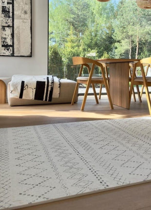 OLYA KIDS Boho Classic schuimpuzzelmat in eetkamer met hanglampen en zonlicht.