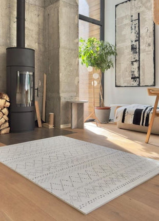 OLYA KIDS Boho Classic schuimpuzzelmat in hoek van woonkamer met houtkachel.