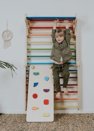 Oploophelling voor de leg&go Piklerdriehoek en Zweedse Muur - Regenboog met kind dat hangt.